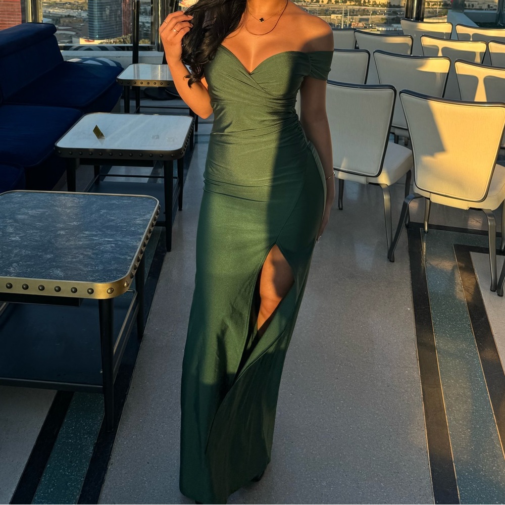 Beautiful green off the shoulder maxi dress with slit.